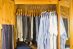 Clothing grouped by type and color. Photo of an orderly closet by vandervelden/istockphoto.com.