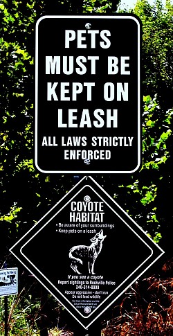A sign warns residents to keep pets on leash due to coyotes. (Photo: marganz/sxc.hu.)