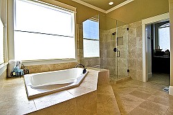 I love this travertine tile bathroom. Sitka Projects LLC/Flickr Creative Commons.
