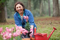 Photo of a mom gardening by kali9/istockphoto.com.