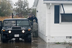 The MD National Guard evacuates a resident. (Photo: The National Guard/Flickr)