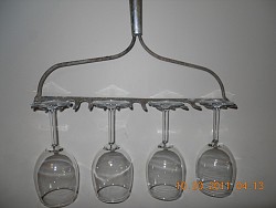 DIY wine glass rack from a rake head (and photo) are by Lee Anne Culpepper for Networx.com.