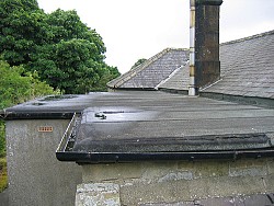 Photo of a leaky flat roof by  Bryn Pinzgauer/Flickr.