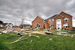 Missing shingles on the roof of a house where a tornado passed by. (Photo: Robert Lawton/Wikimedia Commons)
