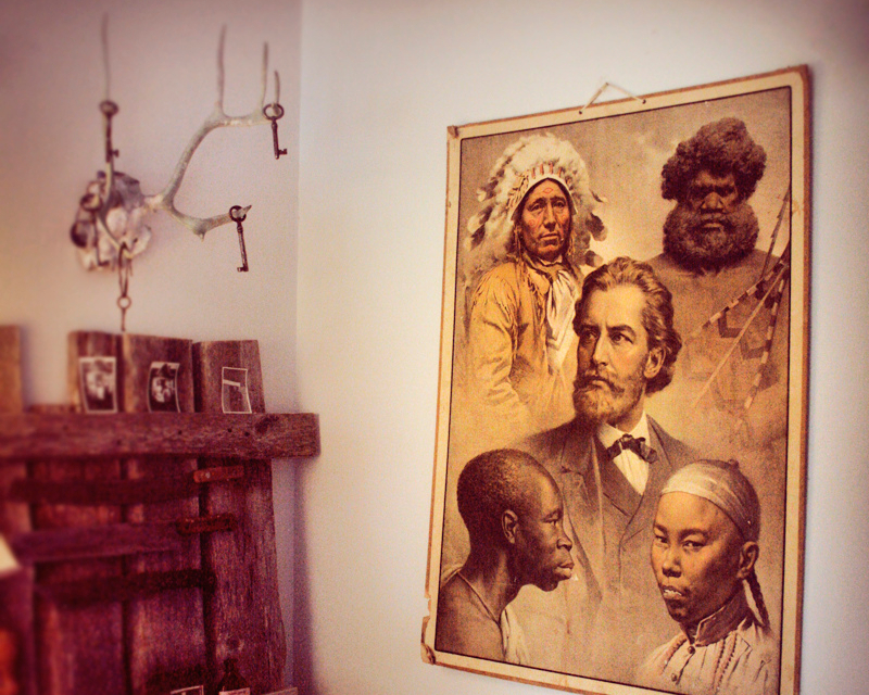 The hipster antiquarian look, complete with deer antlers and eugenicist poster. [Photo: Emilia113/Flickr]
