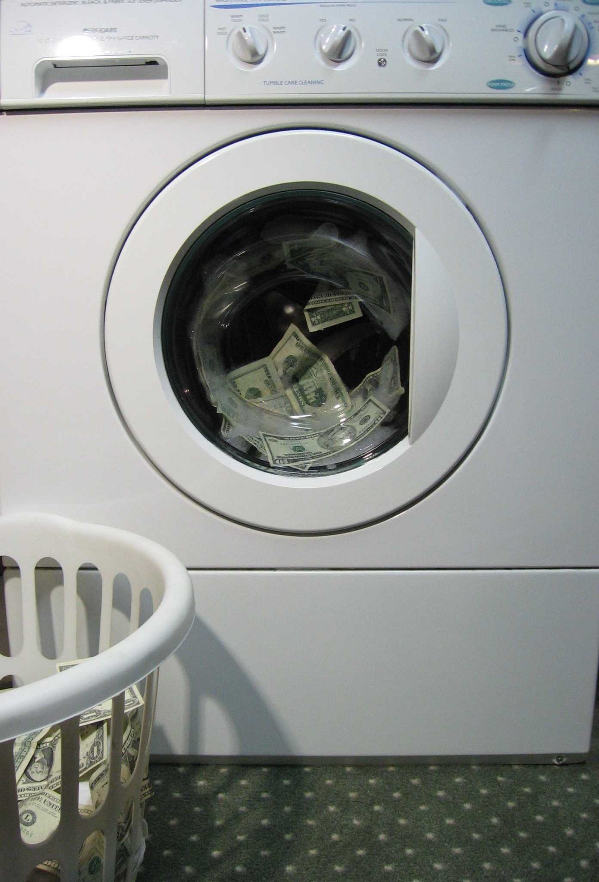 Conceptual photo of a washing machine and money by foobean01/sxc.hu.