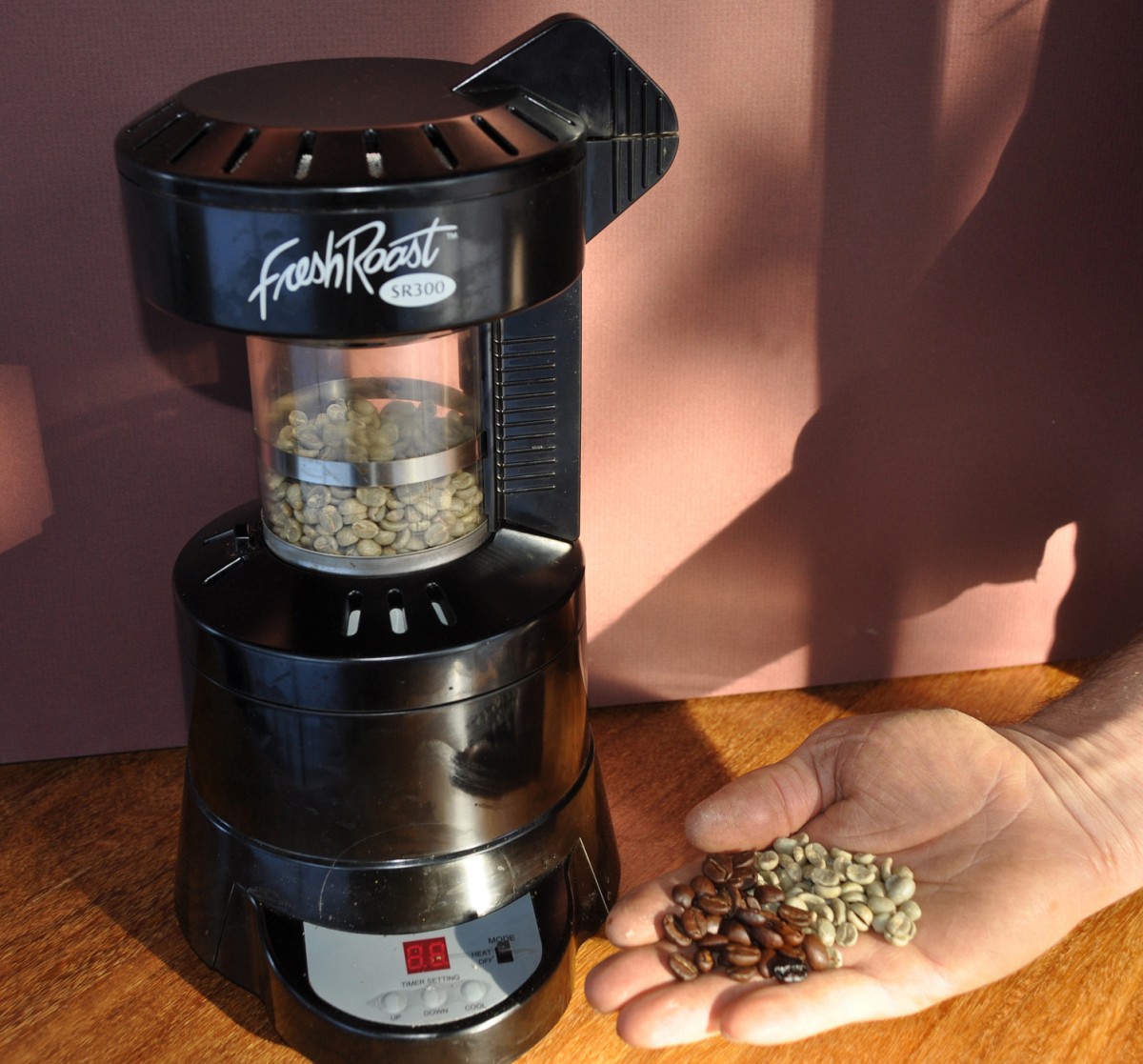 My coffee roaster, with beans before and after.