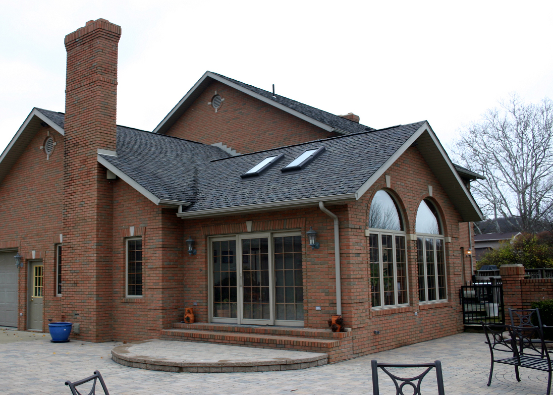 You would need to seal the knee walls in a house like this, which has a bonus room over the garage. (Photo: Kenn W. Kiser/morguefile.com)