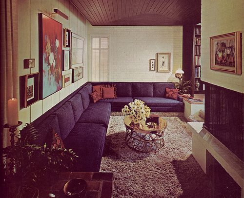 A cool retro living room with painted brick walls and a painted brick fireplace surround. Photo: army.arch/Flickr Creative Commons