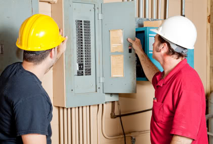 electricians at electrical panel