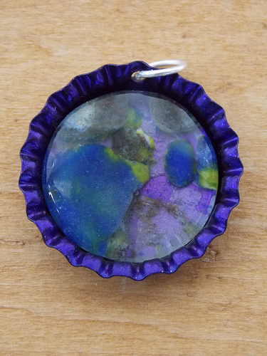 Photo of DIY bottle cap pendant by pwrgrl09bc/Flickr. Photo of DIY bottle cap pendant by pwrgrl09bc/Flickr.