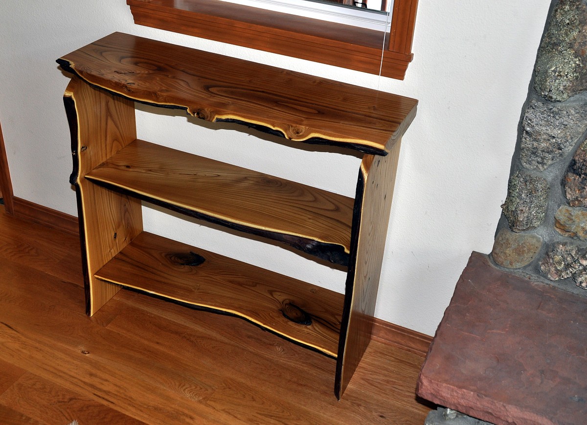 A native edge wood book case made by the author. A native edge wood book case made by the author.