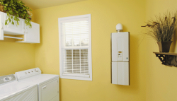 Laundry room tankless water heater/courtesy of Lowe's