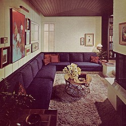 A cool retro living room with painted brick walls and a painted brick fireplace surround. Photo: army.arch/Flickr Creative Commons