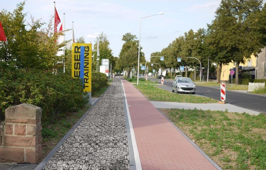 Permeable concrete sidewalk next to pavers/Lowe's (by permission)