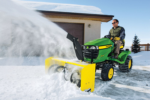 Lawn tractor blowing snow/courtesy of John Deere Lawn tractor blowing snow/courtesy of John Deere
