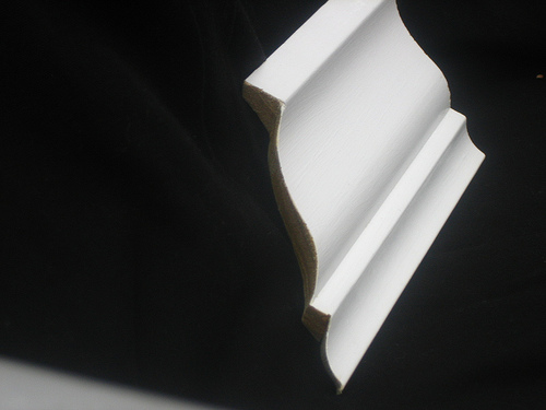 Here's what coped molding looks like: note how it's been cut along the edge of the molding. Photo: Brian Moloney/Flickr Here's what coped molding looks like: note how it's been cut along the edge of the molding. Photo: Brian Moloney/Flickr
