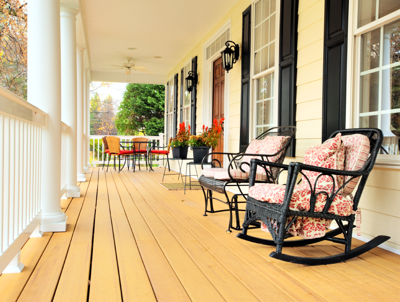 Photo of rattan and iron porch furniture by Cardmaverick/istockphoto.com. Photo of rattan and iron porch furniture by Cardmaverick/istockphoto.com.