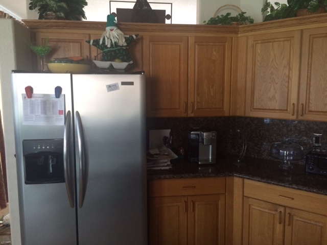 Before: Dark kitchen with original cabinet finish Before: Dark kitchen with original cabinet finish