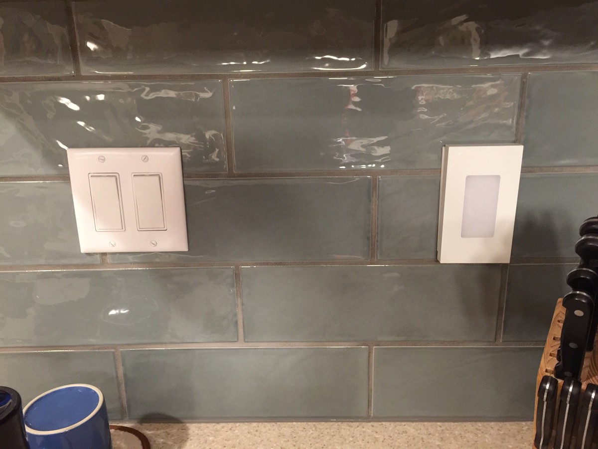 Neat tiling around switchplates Neat tiling around switchplates