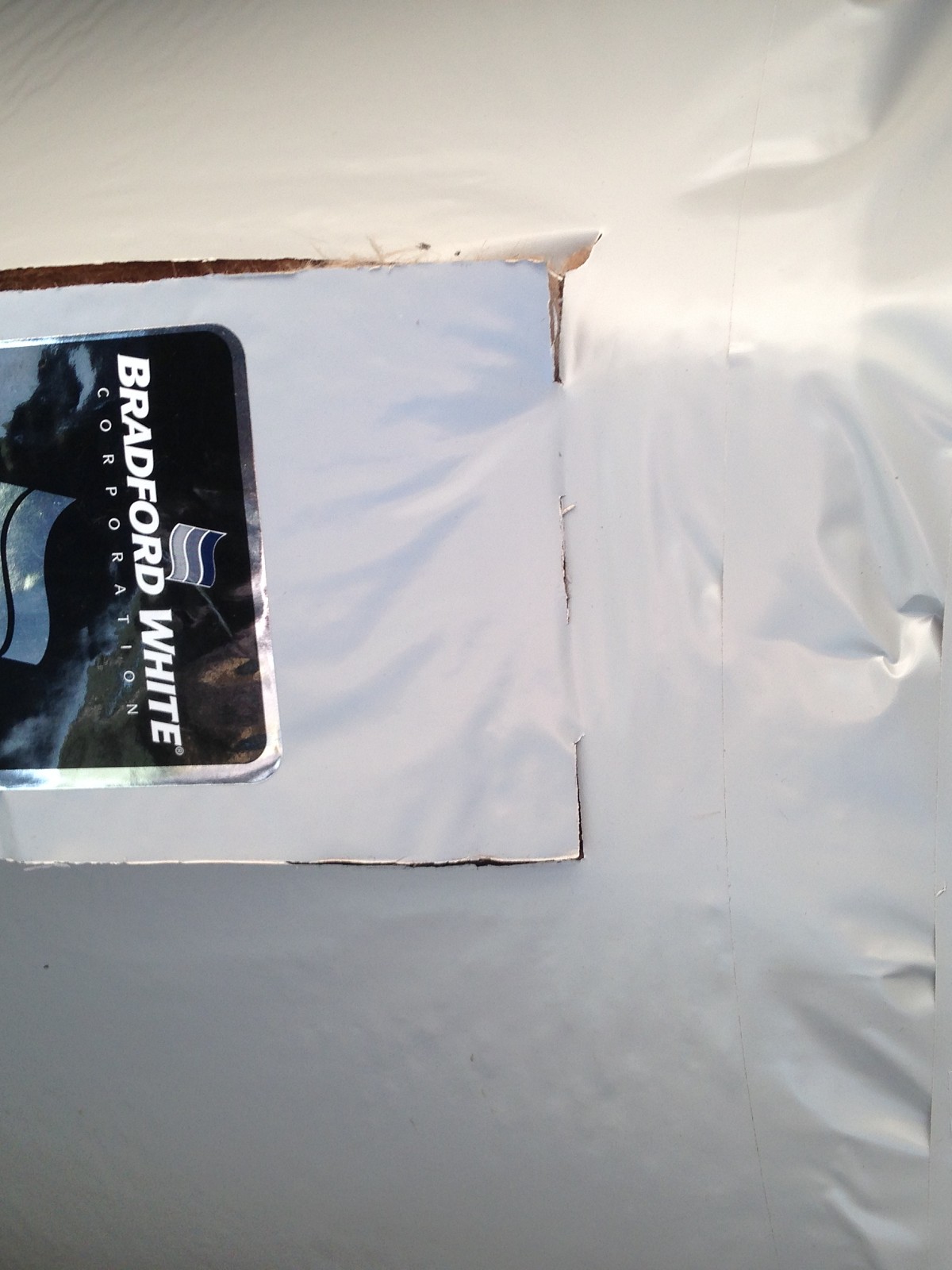 New water heater insulated with thermal blanket